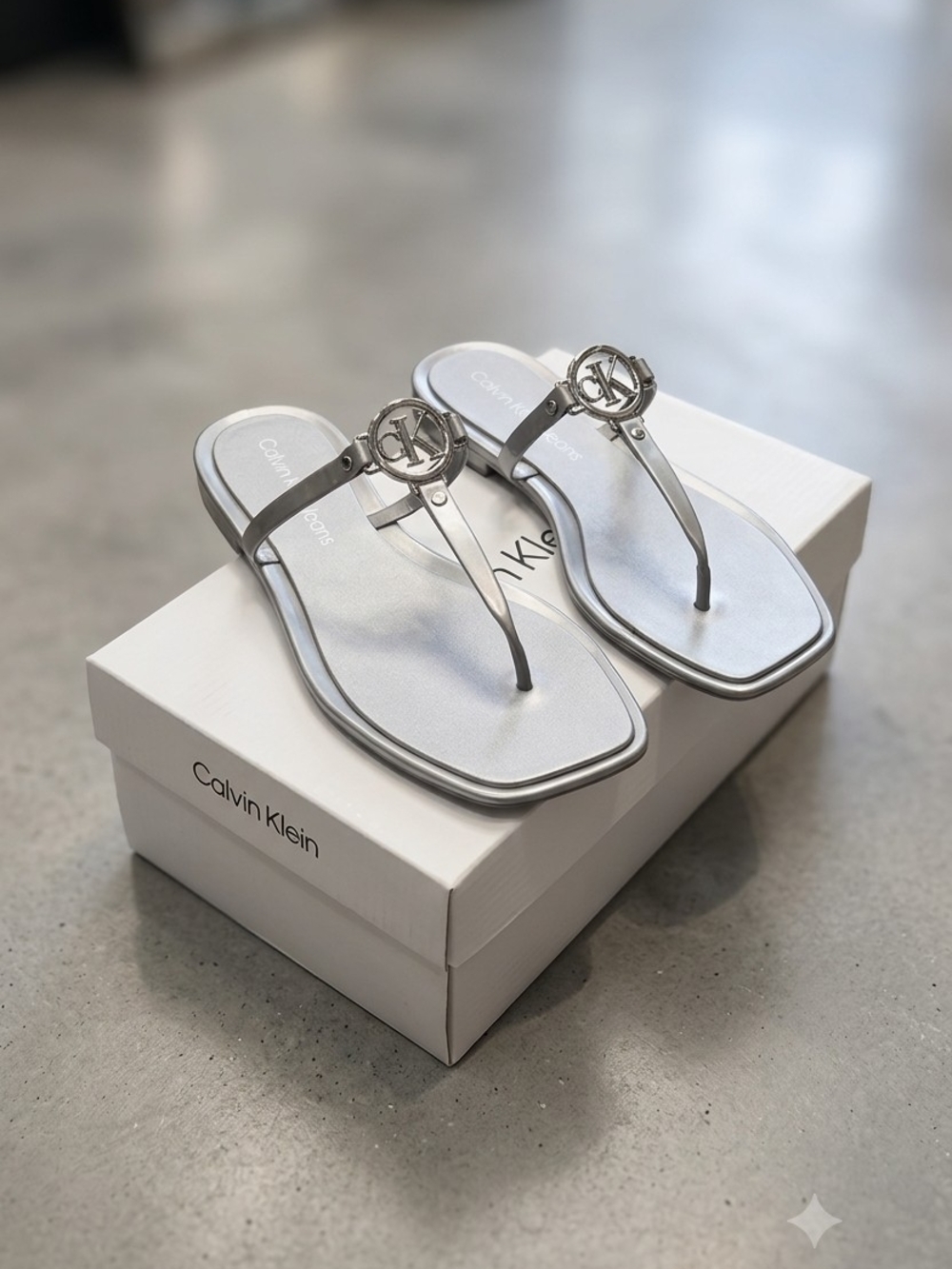 Calvin Klein Metallic Silver Logo Thong Sandals - Women